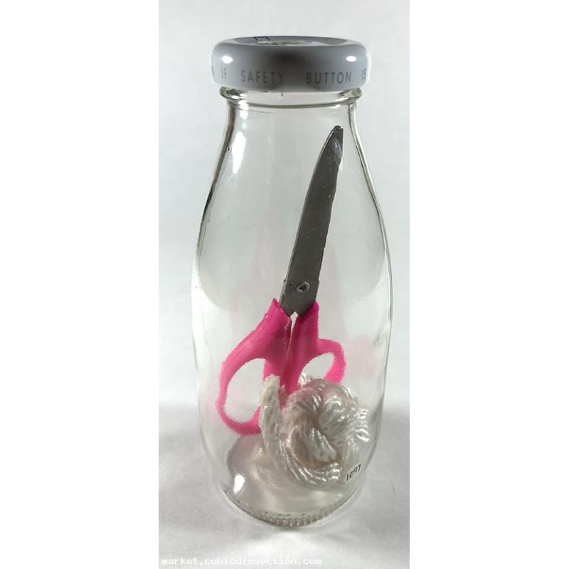 Bottle With Scissor and Knot