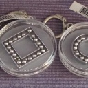set of 4 dexterity puzzle round / key chains