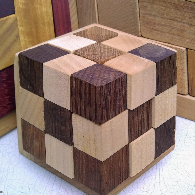 Rhoma and other rhombic blocks packing puzzles