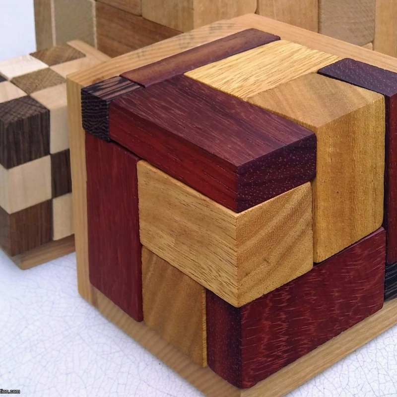 Rhoma and other rhombic blocks packing puzzles