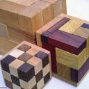 Rhoma and other rhombic blocks packing puzzles