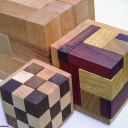 Rhoma and other rhombic blocks packing puzzles