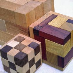 Rhoma and other rhombic blocks packing puzzles