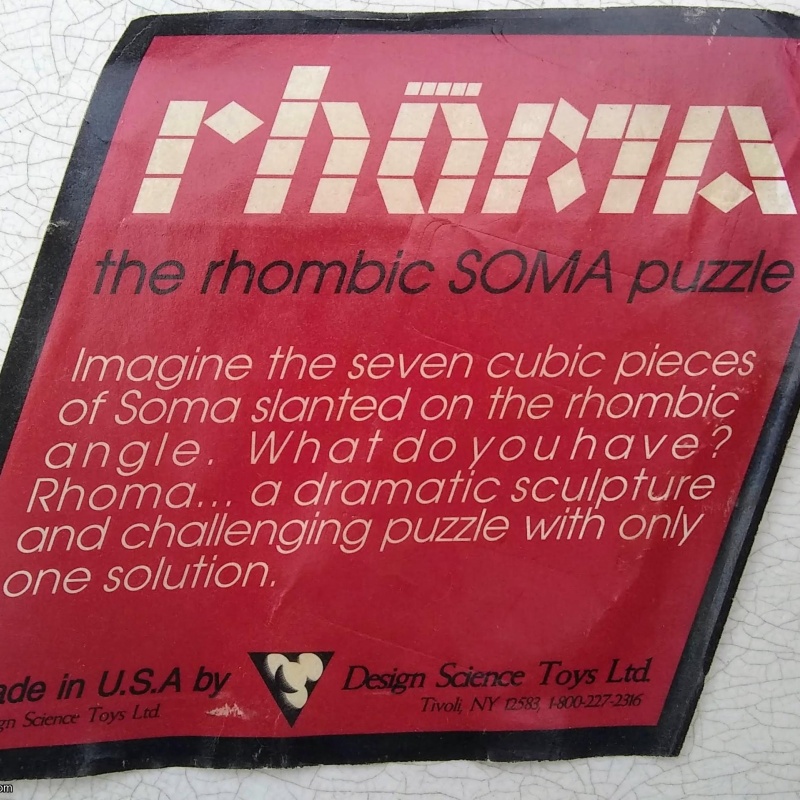 Rhoma and other rhombic blocks packing puzzles