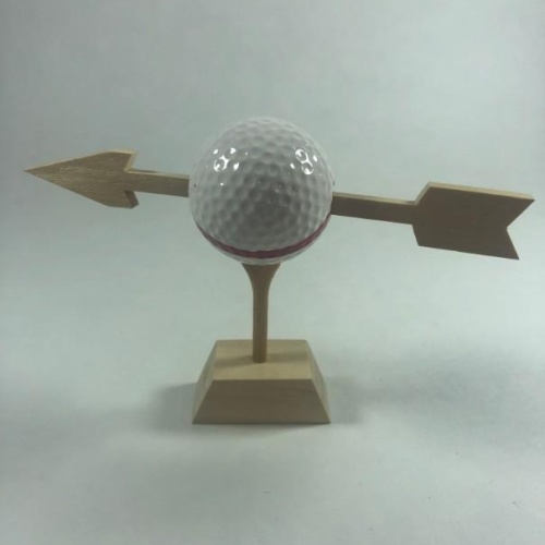 Arrow Through Golf Ball