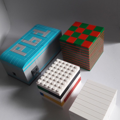 A small lot of pieces built into puzzle boxes