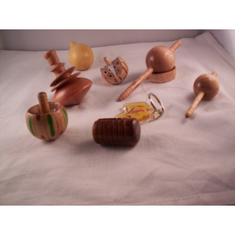 A PIECE OF CHINNOMOTTO, SPINNING TOPS