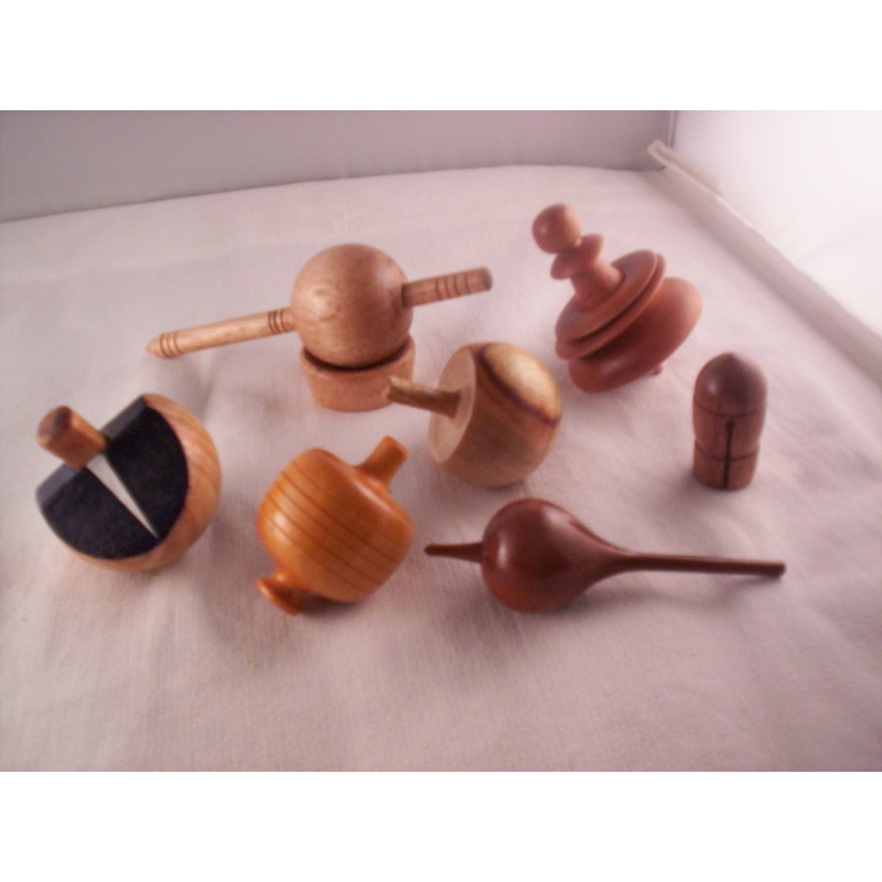 A PIECE OF CHINNOMOTTO, SPINNING TOPS