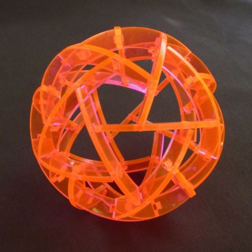 two puzzle sphere sculptures