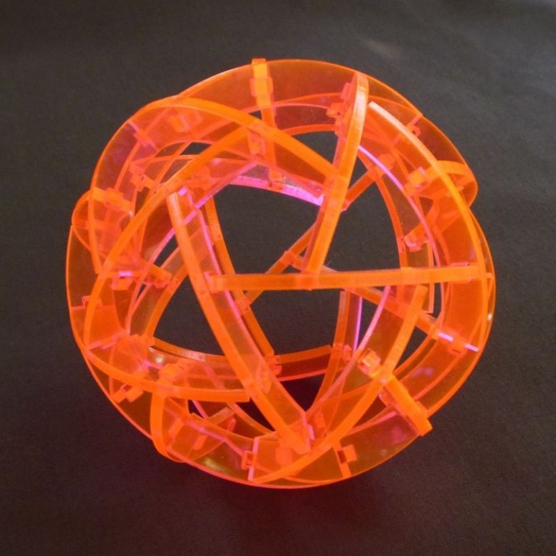 two puzzle sphere sculptures