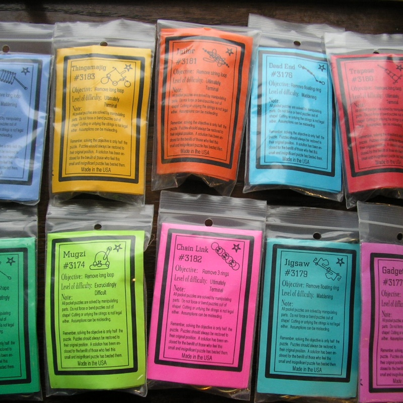 Ten Spilsbury wire puzzles and 2 Puzzlets