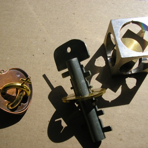 Three metal puzzles, B&P; Free The Key, Amour, Sputnik