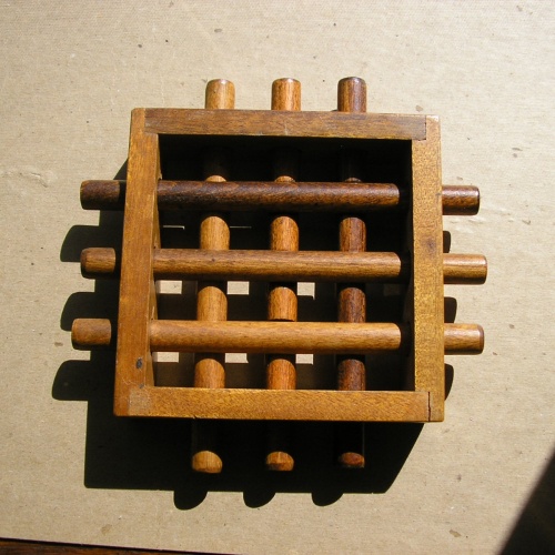 Six Round Sticks in a Frame - from Akron in Los Angeles?