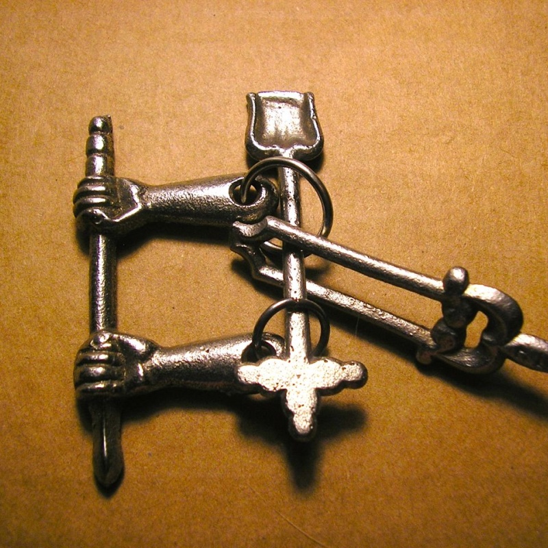 Fire Iron puzzle, cast iron, 1900-1920